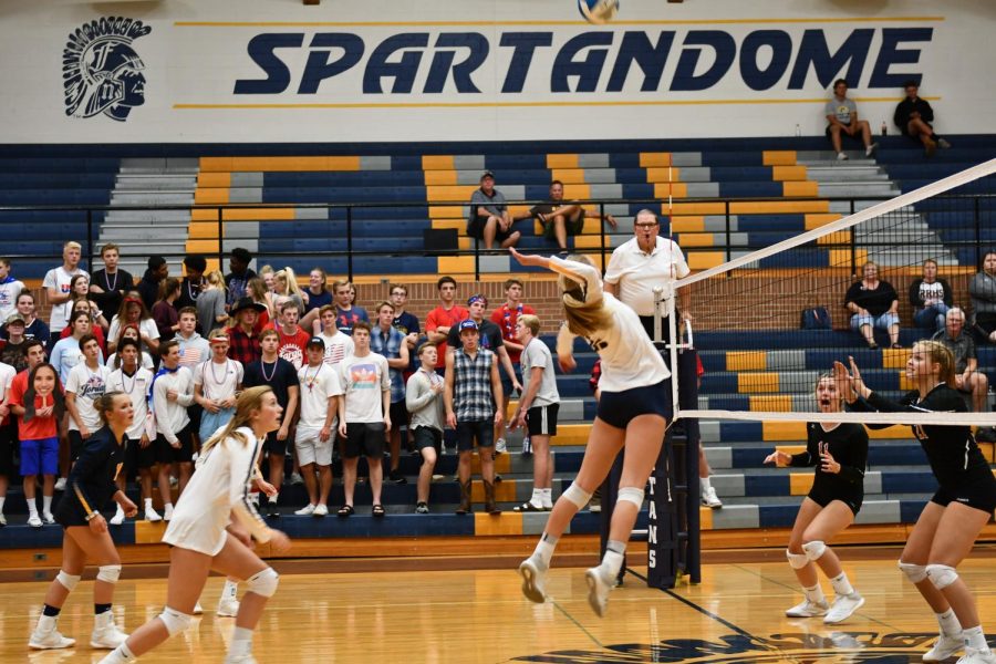 Junior Brooke Swanson goes up for a kill against Red River Tuesday night. 