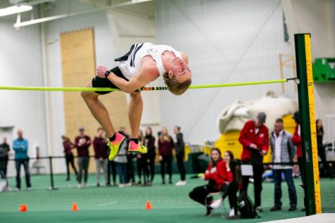 Enerson flipping over the bar in the high jump