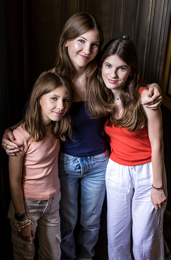Elisa (middle) with her two younger sisters
